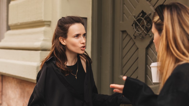 women arguing in street 