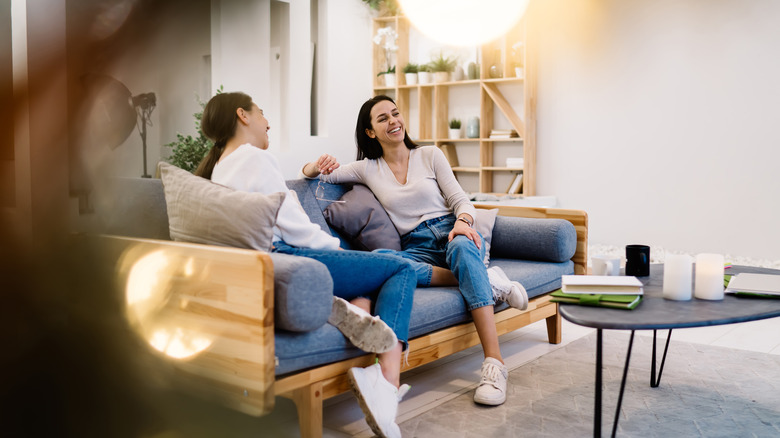 women hanging out together on couch