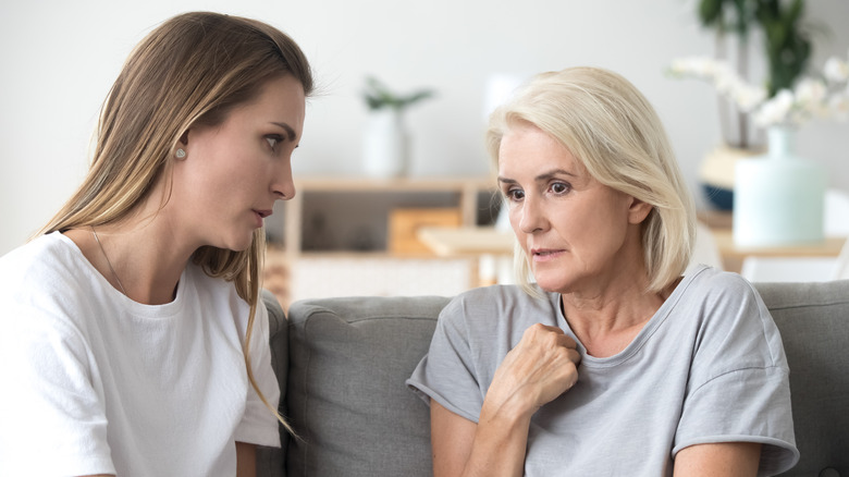 Women talking on couch together