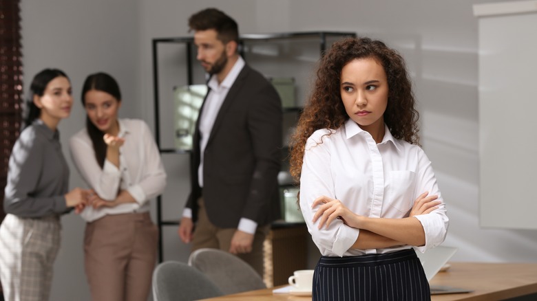 Women gossiping at the office