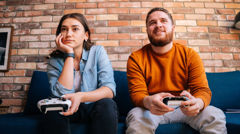 Bored woman with gamer boyfriend