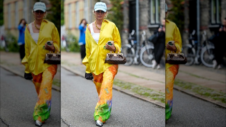 woman wearing printed silk pants