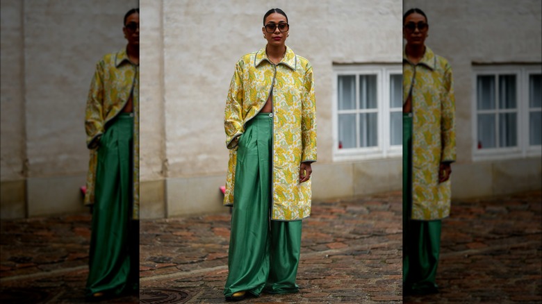 woman wearing green silk pants