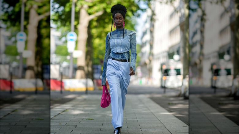 woman wearing blue silk pants