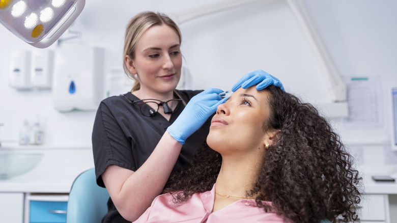 Young woman undergoing Botox treatment