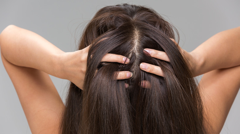 Woman holding scalp