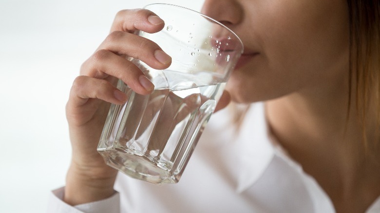 Woman drinking glass of water