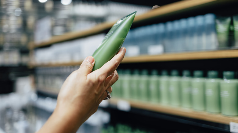 Woman compares products in store