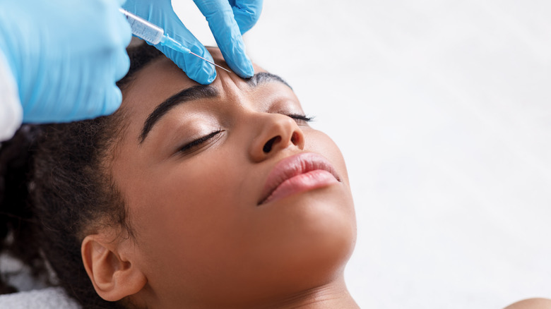 A young woman getting Botox