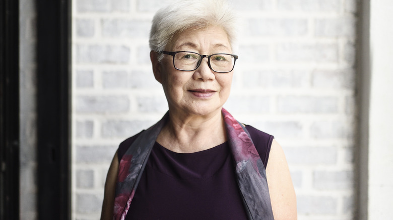 Woman wearing scoop-neck blouse