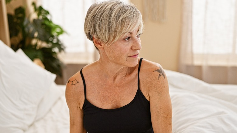 Mature woman in black tank top