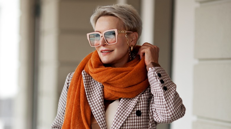 Stylish mature woman wearing scarf