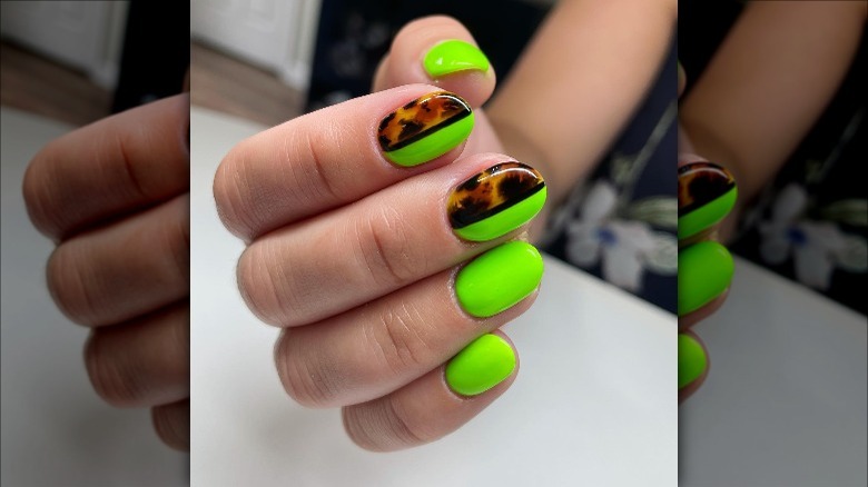 Woman wearing cheetah print nails
