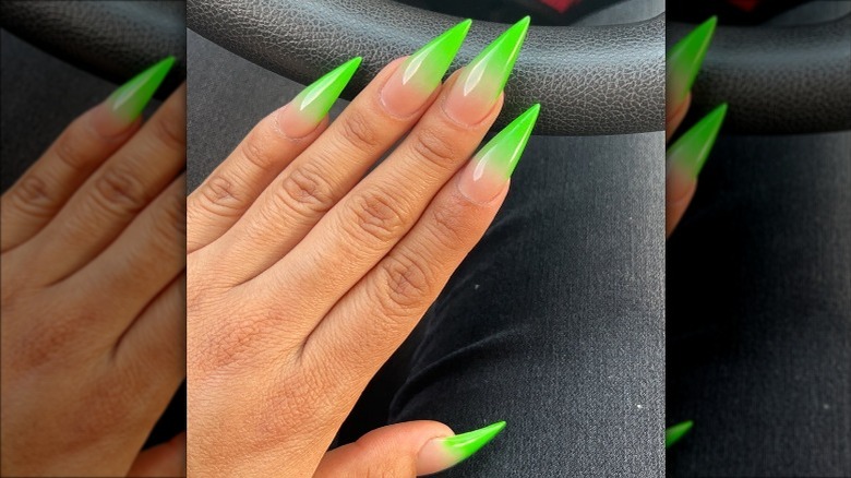 Woman wearing ombré slime green nails