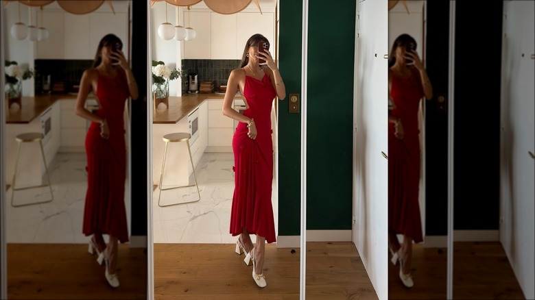 Woman wearing red maxi slip dress with white slingbacks