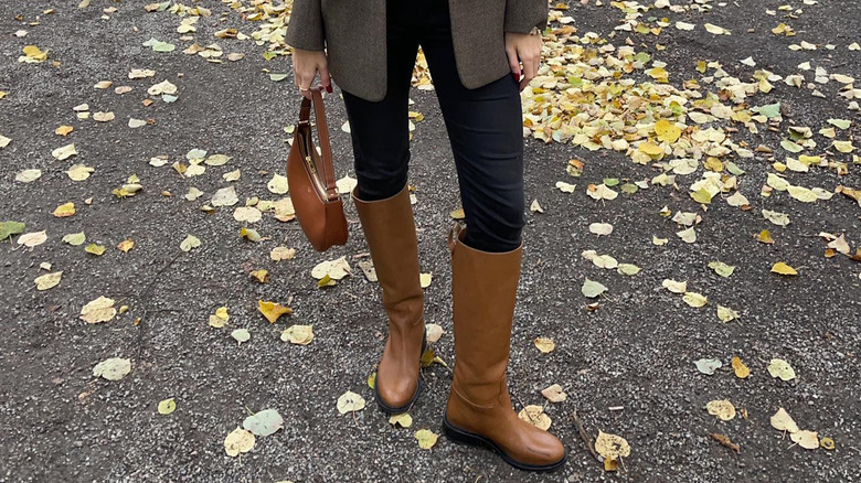 Woman wearing brown knee-high boots