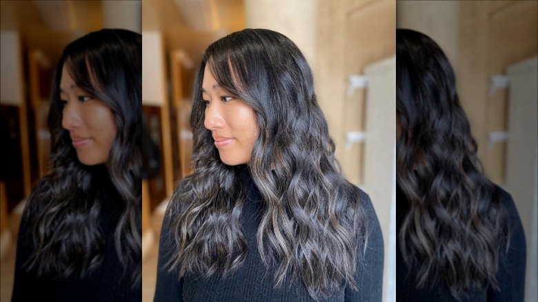 Woman with ashy brown waves