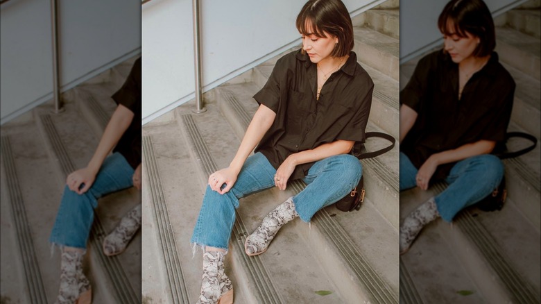 Woman in jeans, snakeskin boots