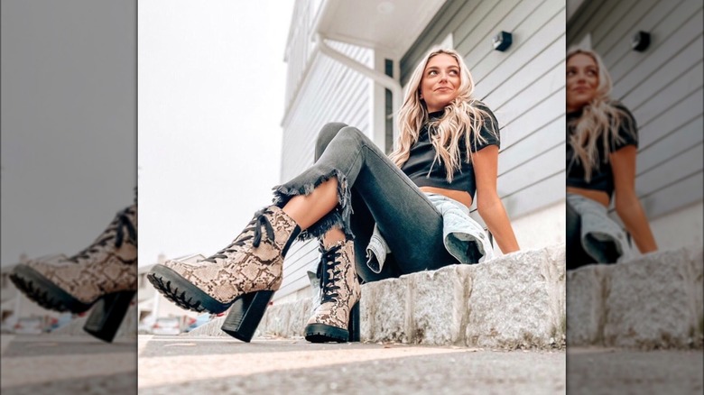 Woman in chunky snakeskin boots