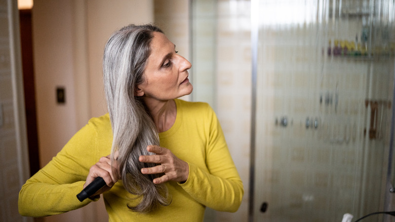 A woman brushing her hair