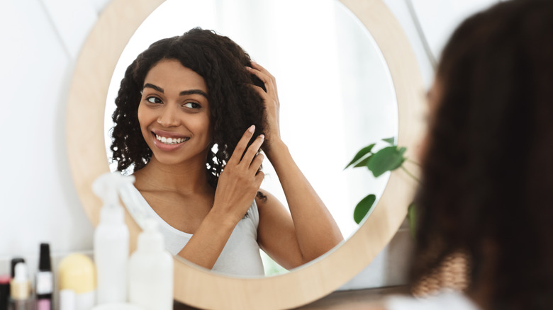 A woman fixing her hair