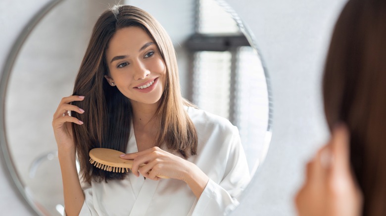 A woman brushing her hair