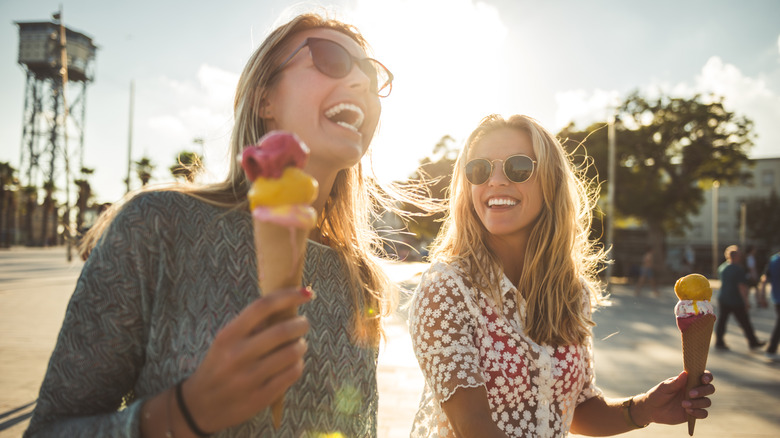 two women holding ice cream