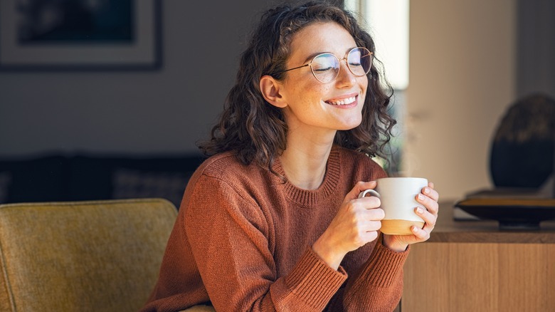 Woman enjoys cup of coffee