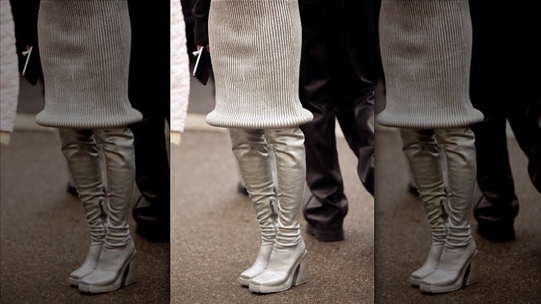 woman wearing metallic sock boots