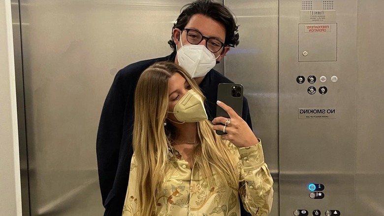 Sofia and partner wearing masks