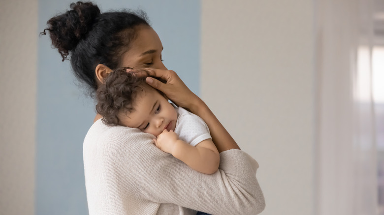 woman holding infant