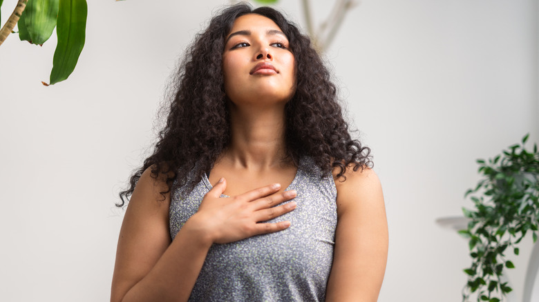 Woman takes deep breath