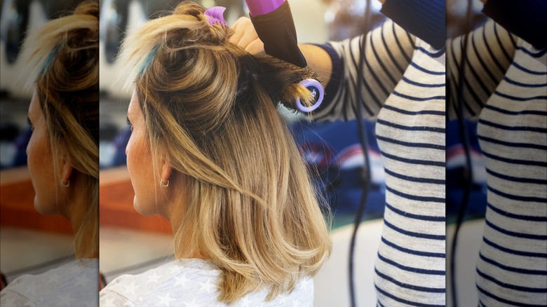 woman having hair styled