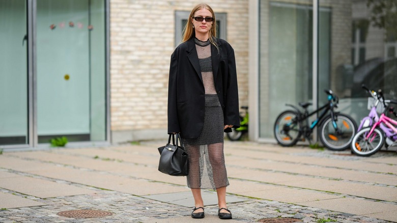 woman wearing sheer dress and flats