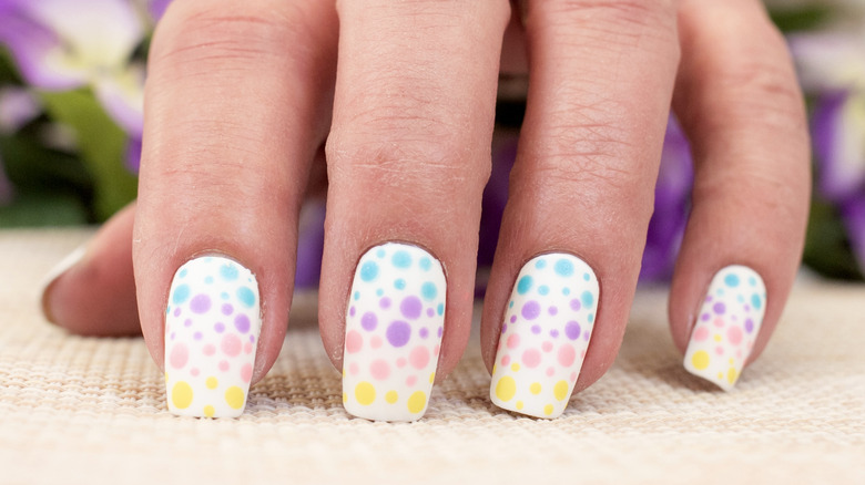 White nails with multi-colored dots