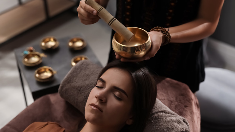 Woman laying down during sound healing session