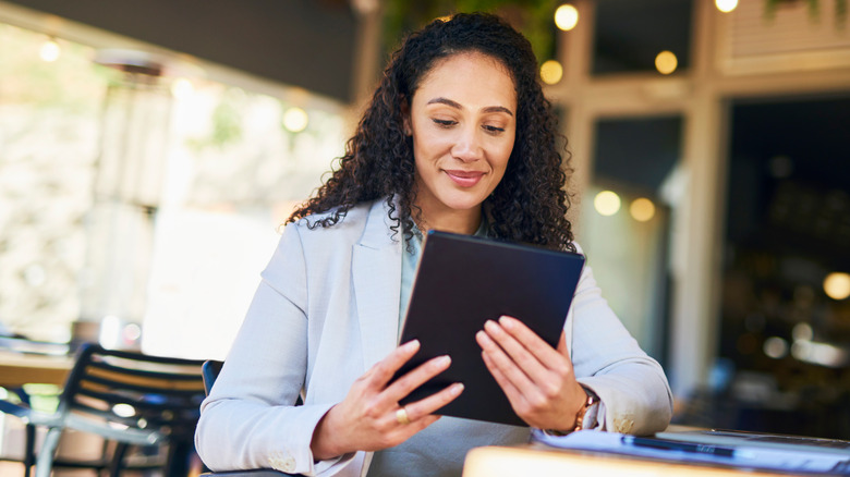 Woman browses on tablet