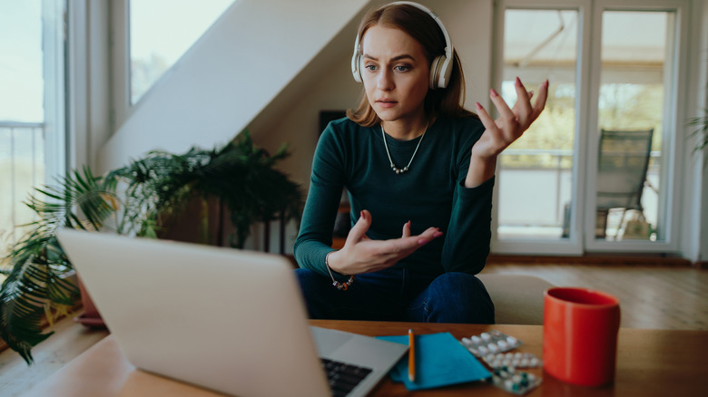 Woman in deep thought on video call