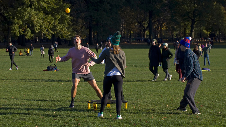 People playing Spikeball in park