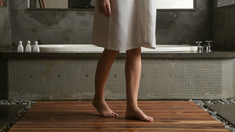 Woman getting out of tub