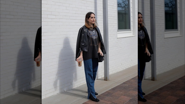 Girl wearing leather with split-hem denim