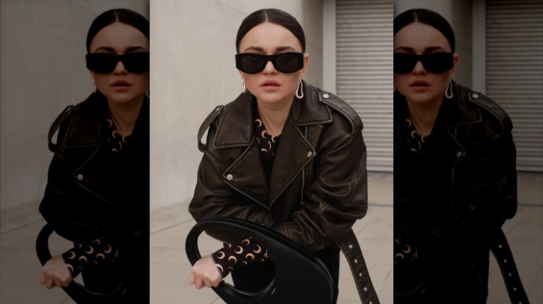 Sporty sunglasses and leather jacket