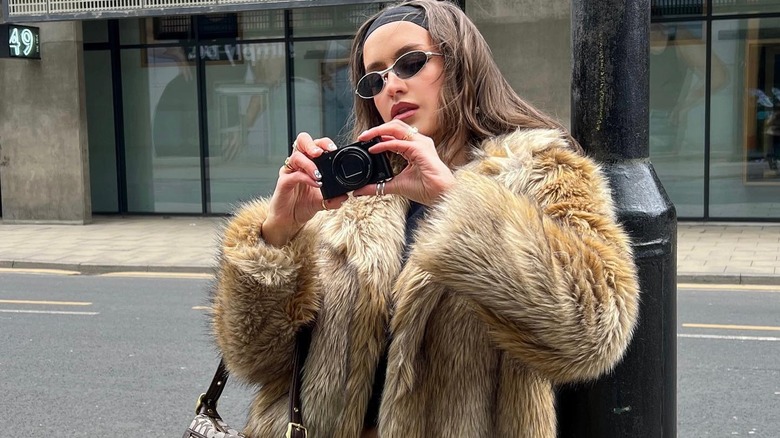 Sporty sunglasses and fur coat