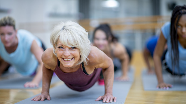 Woman exercising and smiling