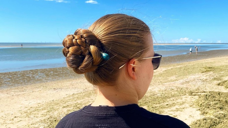 woman with rose bun 