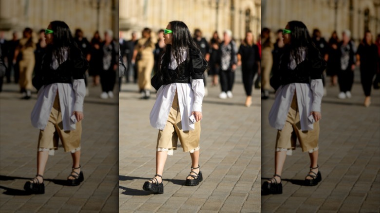 woman wearing khaki bermuda shorts