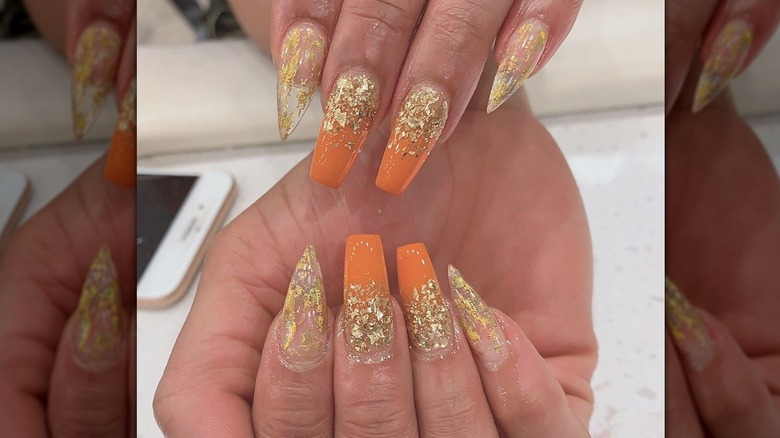 gold and orange fingernails