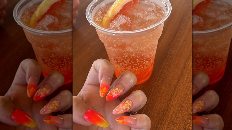 dotted fingernails and drink