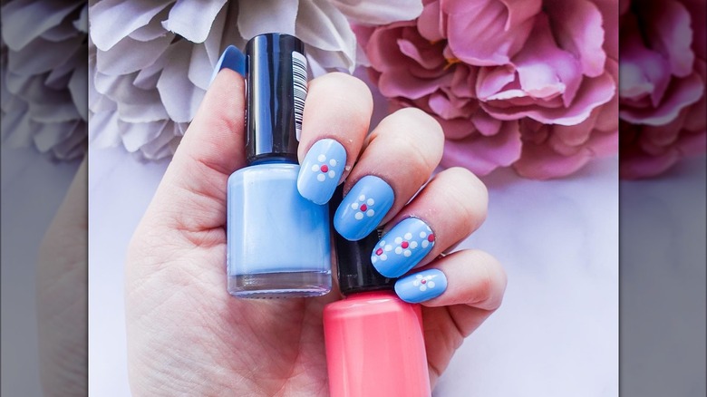 hand with floral squoval nails