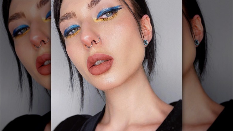 woman with blue cat eye liner